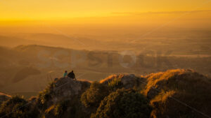 A couple taking in the view at sunset on Te Mata Peak, Havelock North, Hawke’s Bay, New Zealand - SCP Stock