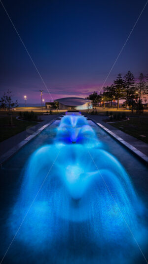 Blue fountains at blue hour on Marine Parade, Napier, Hawke’s Bay, New Zealand - SCP Stock