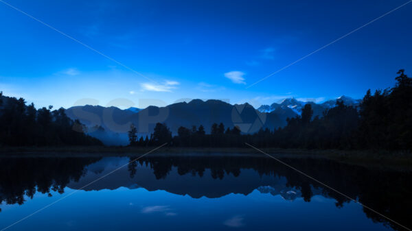 Dawn at Lake Matheson, Fox Glacier, South Westland - SCP Stock