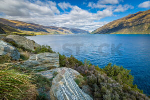 Layered Boulders on the Banks of a South Island Lake, New Zealand - SCP Stock