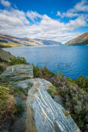 Layered Boulders on the Banks of a South Island Lake, New Zealand - SCP Stock