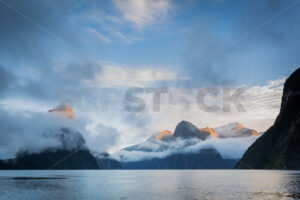 Mitre Peak Hiding Behind  Low Clouds, Milford Sound, Fiordland, New Zealand - SCP Stock