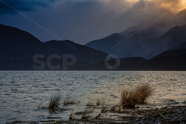 Moody Skies at Sunset, Lake Te Anau, Southland, New Zealand - SCP Stock