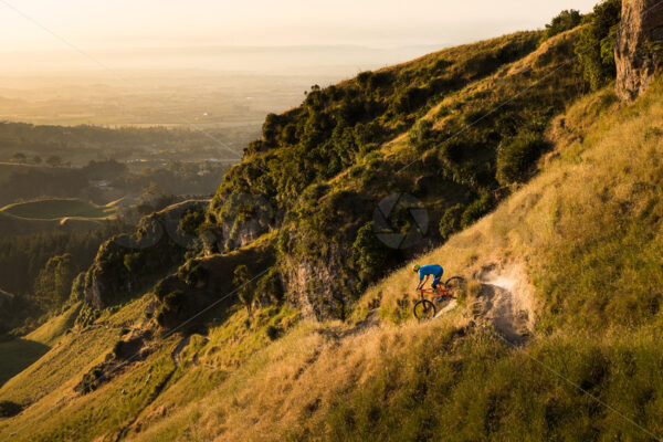 Mountain Biking at golden hour on Te Mata Peak, Hawkes Bay, New Zealand - SCP Stock