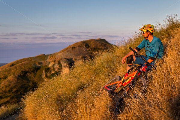 Mountain Biking at golden hour on Te Mata Peak, Hawkes Bay, New Zealand - SCP Stock