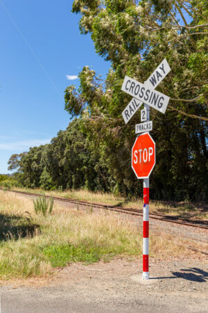 Railway crossing and stop sign, Eskdale, Hastings District, Hawke’s Bay, new Zealand - SCP Stock