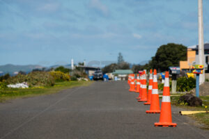 Road cones along the side of the road, Hawke’s Bay, New Zealand - SCP Stock