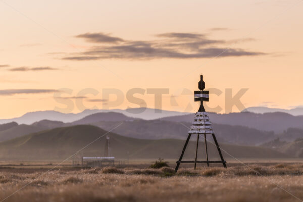 The trig near Hawke’s Bay Airport at sunset, Napier, Hawke’s Bay, New Zealand - SCP Stock