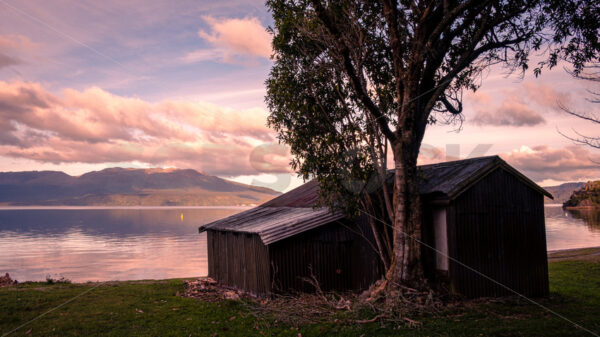 Boat shed on the bank of Lake Tarawera, Rotorua, Bay of Plenty, New Zealand - SCP Stock