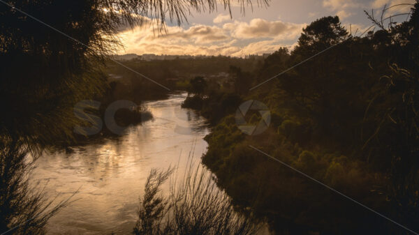 The Mighty Waikato river in the late afternoon, Taupo, Waikato, New Zealand - SCP Stock