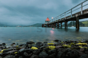 Daly’s Wharf historic jetty, Akaroa Harbour, Banks Peninsula, Canterbury, New Zealand - SCP Stock