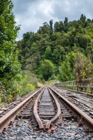 Rusty railway tracks, Whangamomona, New Zealand - SCP Stock